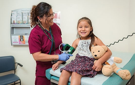 NATIVE HEALTH medical provider caring for a patient